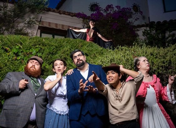 Six people posing for a production shot