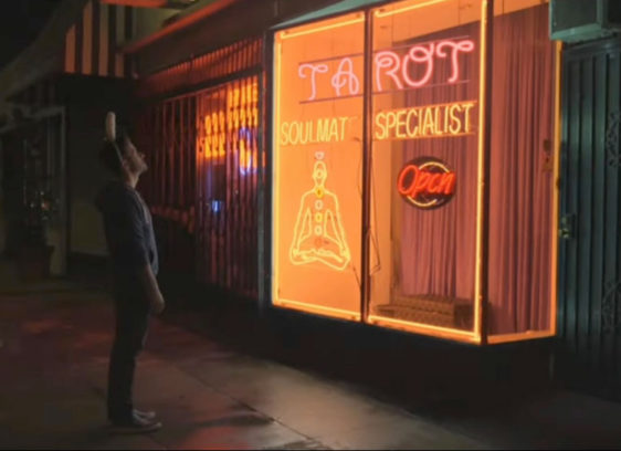 Movie still of a tarot reading shop