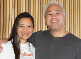 Man and woman posing for photo