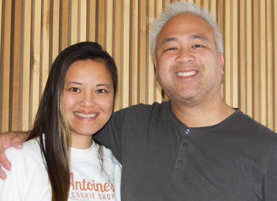 Man and woman posing for photo