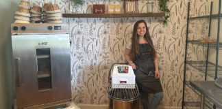 Woman in a kitchen with equipment for bread mating