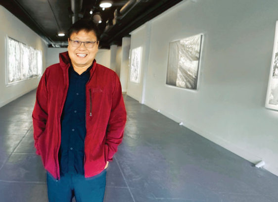 man in an art gallery