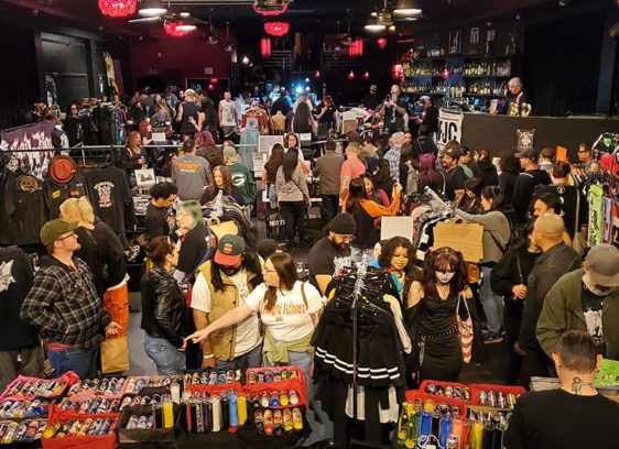 Nightclub filled with people selling merchandise