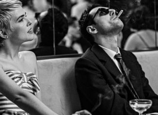Man and woman in a bar, shot in black and white film