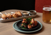 two plates of food and a beer