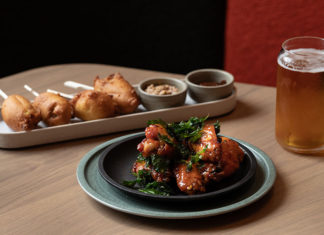 two plates of food and a beer