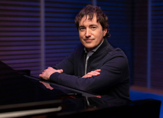 Man posing at a keyboard