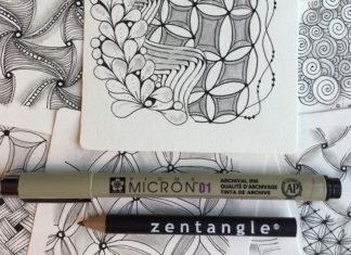 Closeup of artwork with drawing utensils