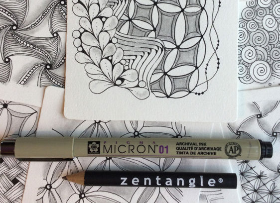 Closeup of artwork with drawing utensils