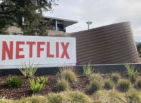 Photo of office building with Netflix sign in front