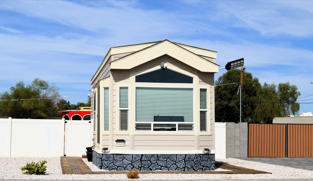 Modular accessory dwelling unit with gray stone base and window band