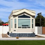 Modular accessory dwelling unit with gray stone base and window band