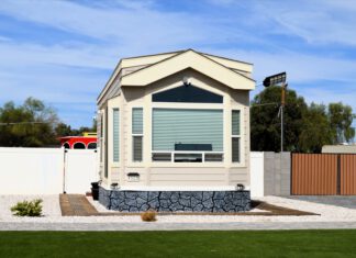 Modular accessory dwelling unit with gray stone base and window band