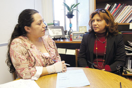 Adel Olivera of the Immigration
and Citizenship Program with new citizenship applicant Rosalba Marquez